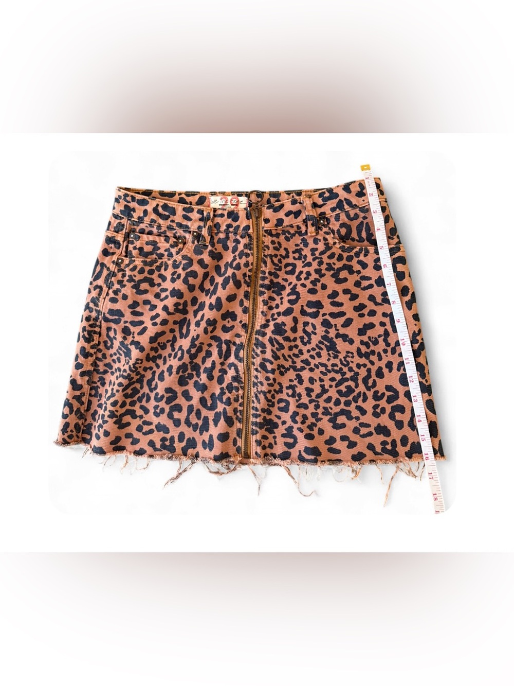 Free People We The Free Leopard Zip-Front Mini Skirt in Brown and Black. Size 29